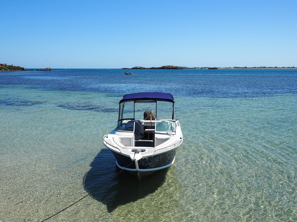 little boat in turquoise water , Western Australia
